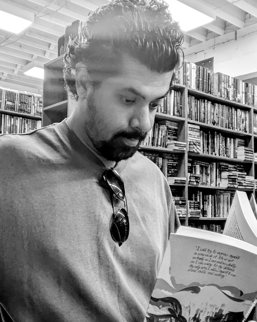 Prashant Anilkumar reading in a bookstore.